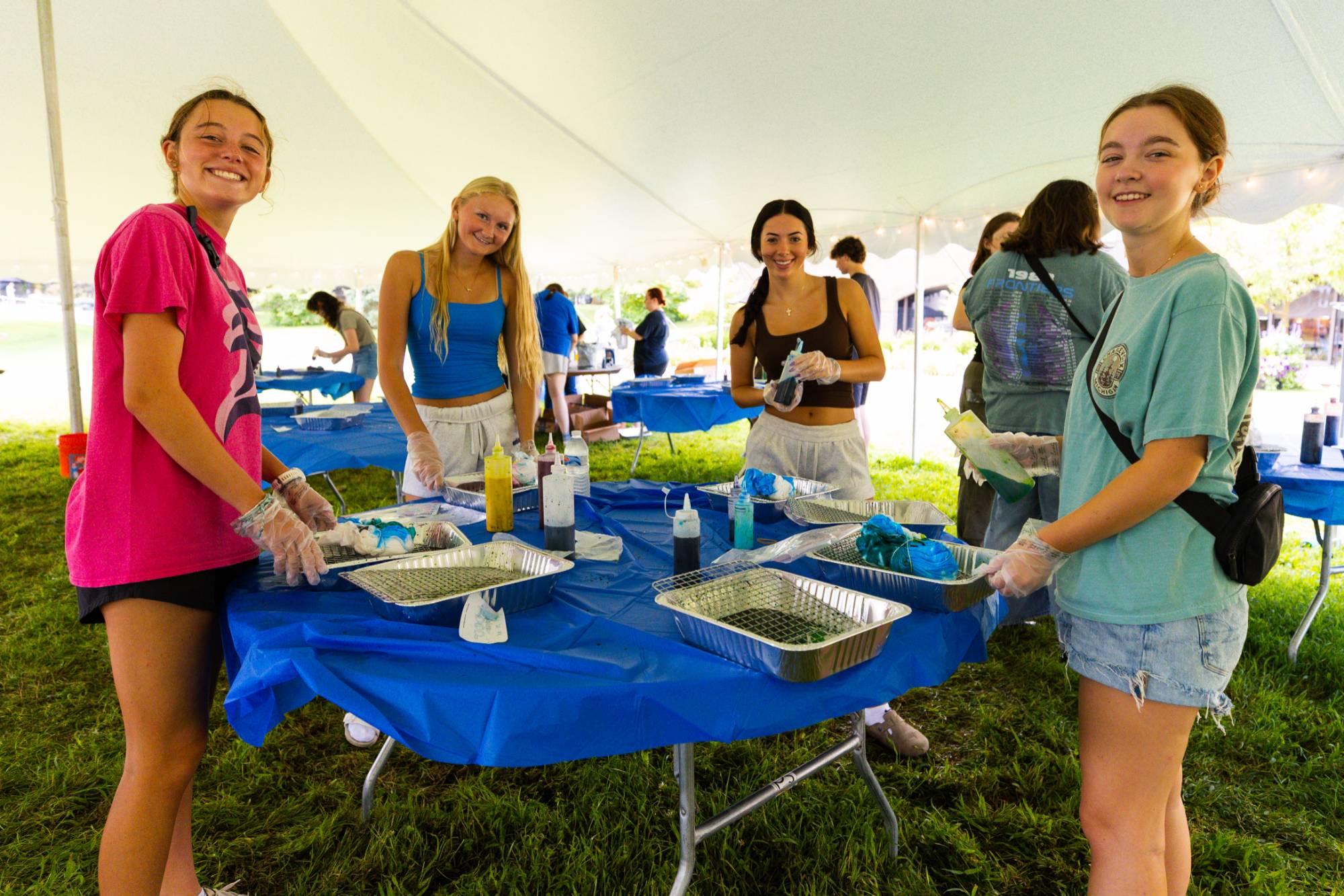 girls standing and posing for a photo while tie-dying